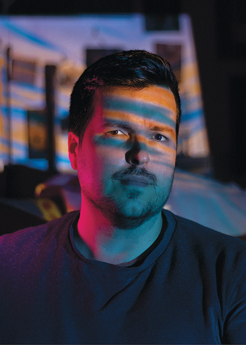 a headshot Richard Powell with light dancing on his face